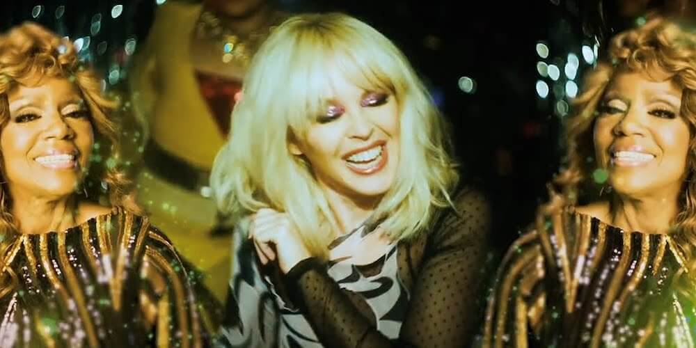 Kylie Minogue & Gloria Gayner Gave Us a “Can’t Stop Writing Songs About You” Video